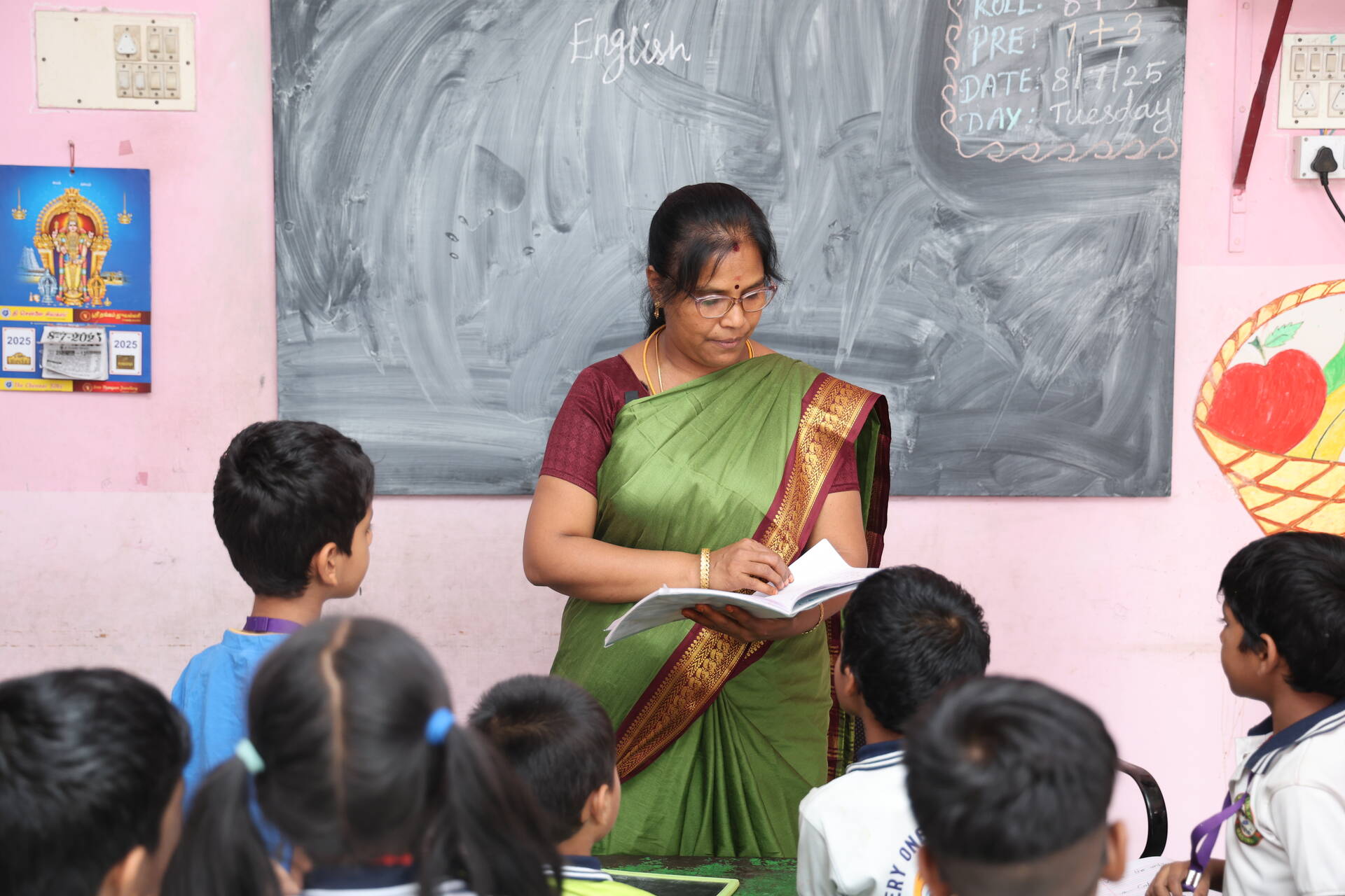 A teacher taking learners through a lesson in an Affordable Non-state School. Photo Credit: Jason Amoo/Opportunity International